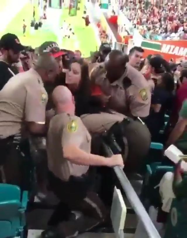 Woman at University of Miami game slaps cop as she's getting arrested, cop retaliates